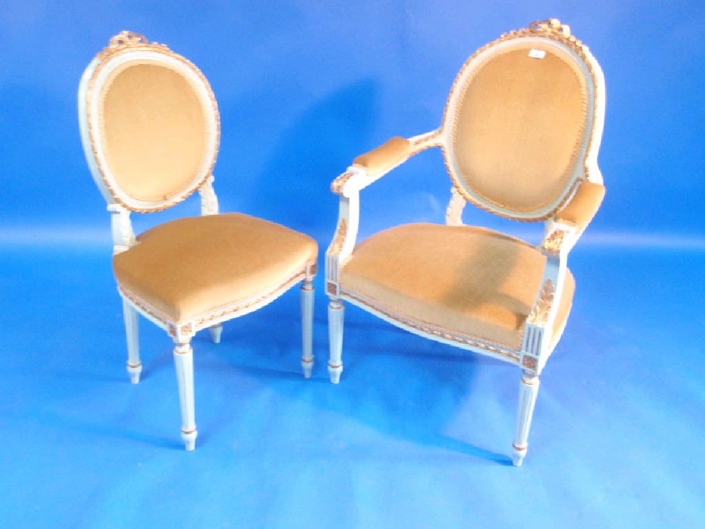 Appraisal: Two thC French gold and powder blue painted salon chairs