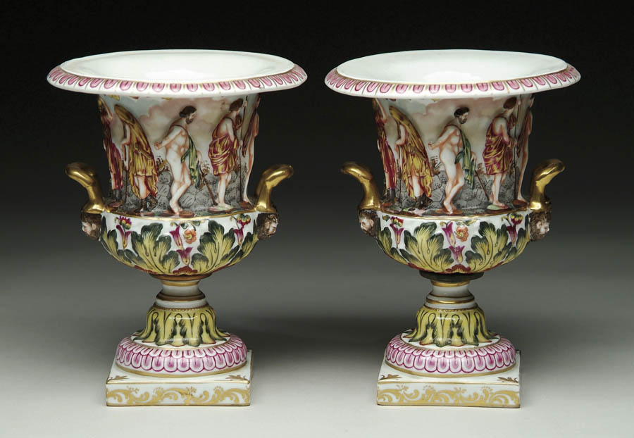 Appraisal: PAIR OF CAPO DI MONTE URNS Wide flaring two handled