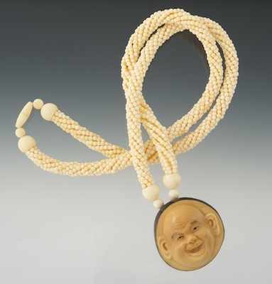 Appraisal: A Carved Tagua Nut and Ivory Bead Necklace Carved tagua