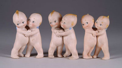 Appraisal: THREE GERMAN KEWPIE HUGGERS - HT CONDITION One of three