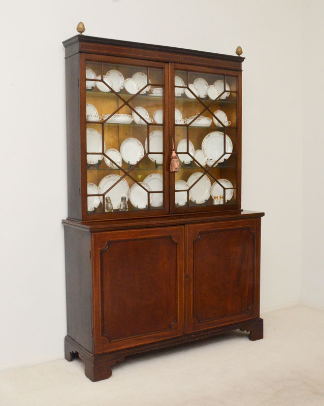 Appraisal: LARGE VICTORIAN MAHOGANY CHINA CABINET Stepped cornice with brass pineapple