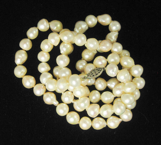 Appraisal: OPERA LENGTH PEARL NECKLACE strung with well matched cream colored