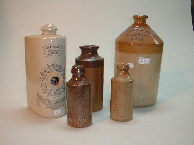 Appraisal: A stoneware spirit bottle impressed Mowbray Co Ltd Wine Spirits