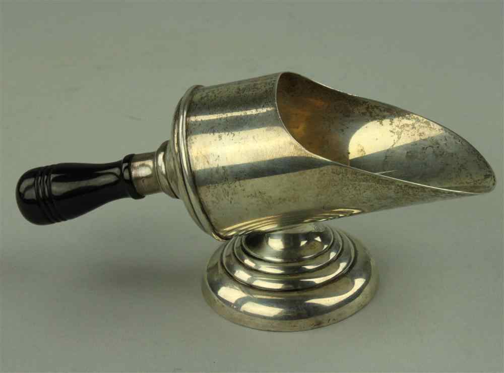 Appraisal: GENOVA SILVER SUGAR SCOOP WITH WOODEN HANDLE Early th century