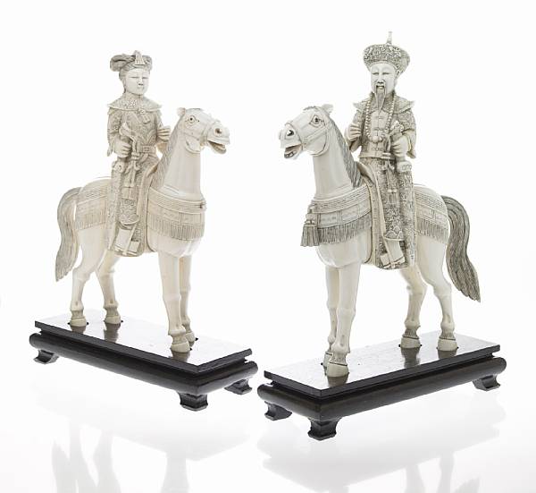 Appraisal: A pair of Chinese pieced ivory Emperor and Empress figures