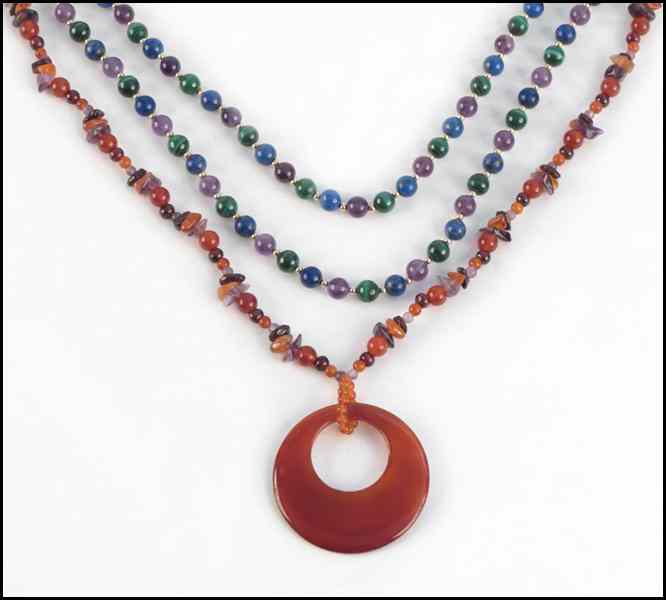 Appraisal: AMETHYST AMBER AND CARNELIAN PENDANT NECKLACE Together with a pair