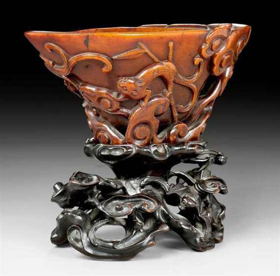 Appraisal: A FINE RHINOHORN CUP CARVED WITH QILONG BAMBOO AND LINGZHI