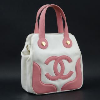 Appraisal: Chanel Pink White Canvas Tote Matte gold hardware Chanel fabric