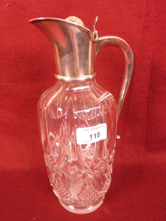 Appraisal: A cut glass claret jug with a silver mount