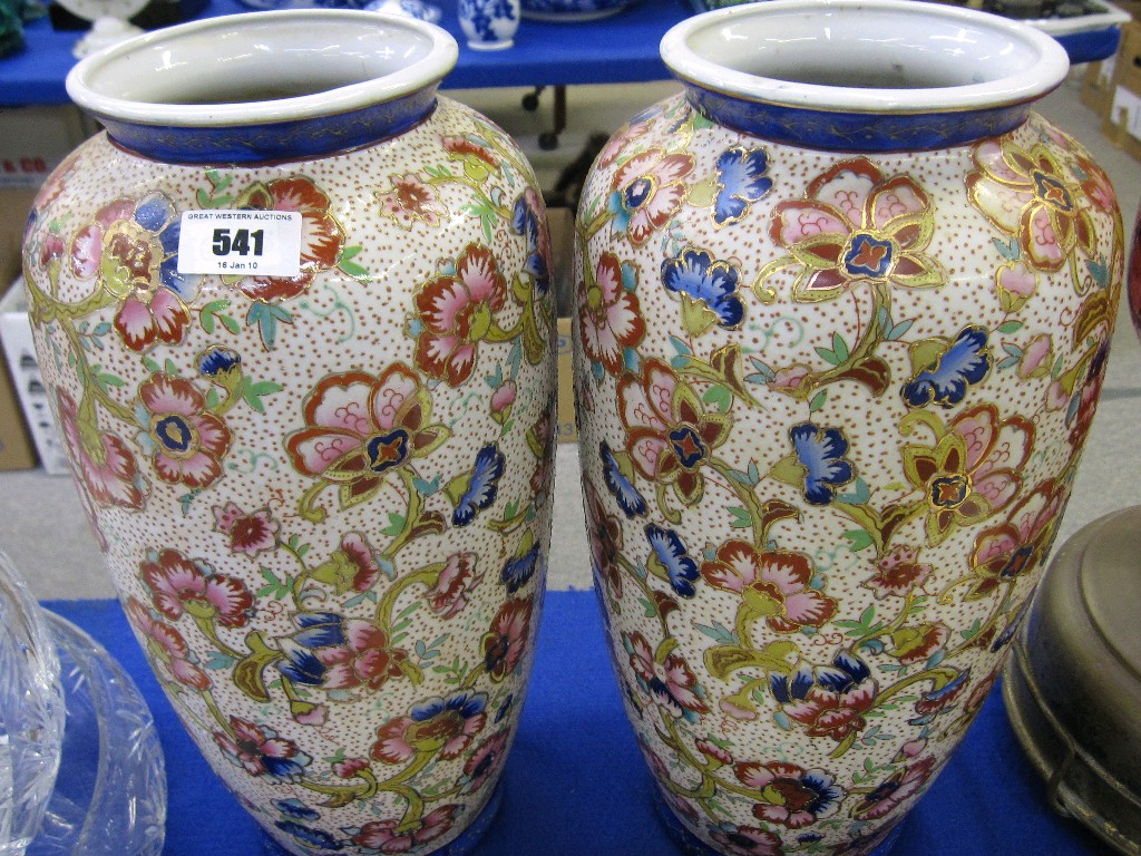 Appraisal: Pair of large pottery vases with floral and gilt decoration