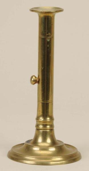 Appraisal: English Brass Side Ejector Candlestick Description Core-cast Round base has