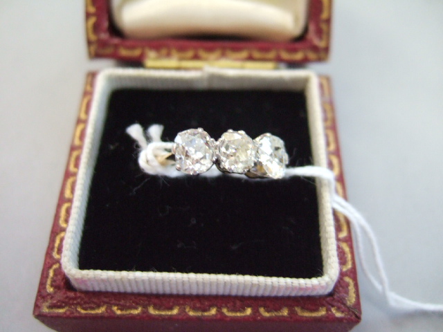 Appraisal: A gold and diamond set three stone ring claw set