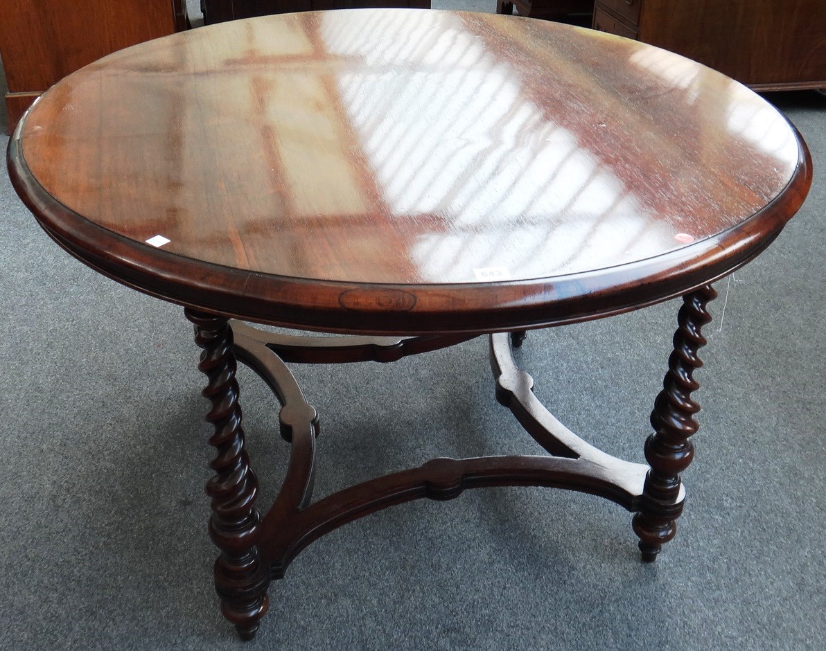 Appraisal: A Victorian rosewood circular centre table on four barleytwist supports