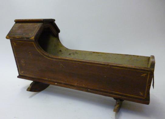 Appraisal: A late Victorian painted and lined pine doll's cradle on