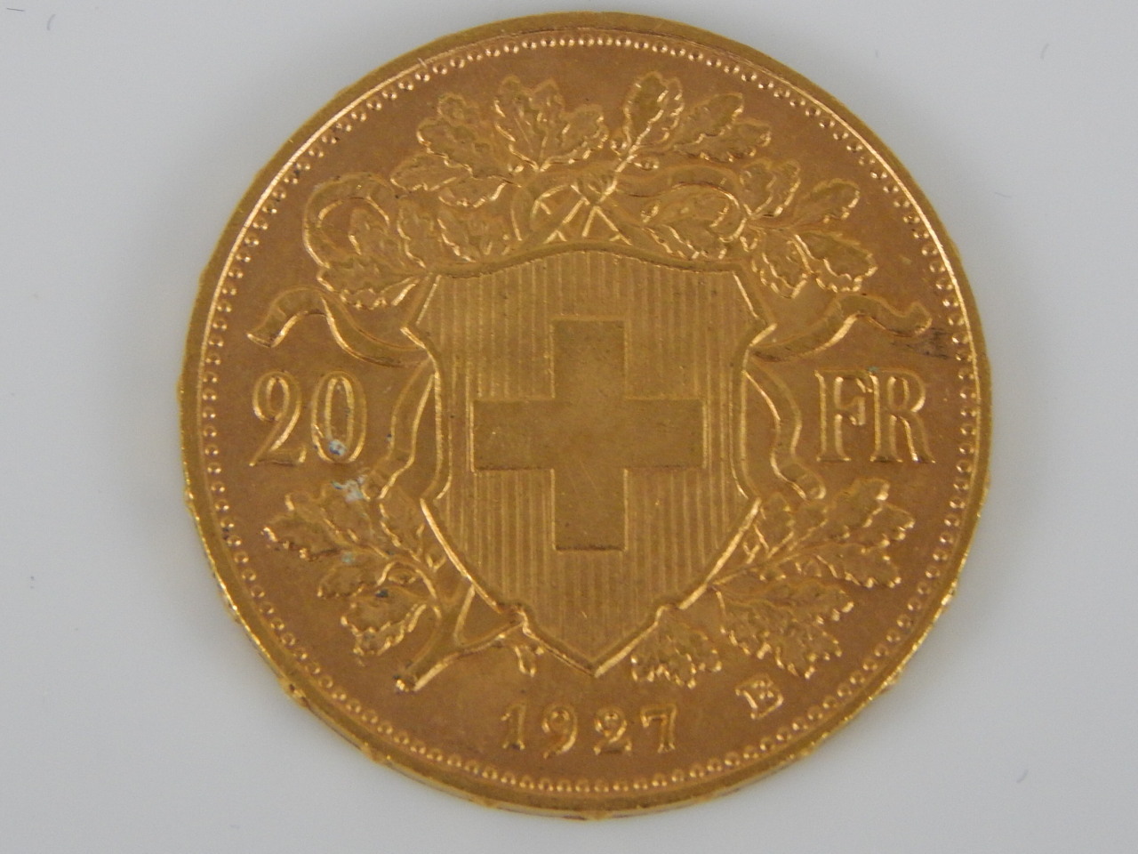 Appraisal: A gold Swiss franc coin dated