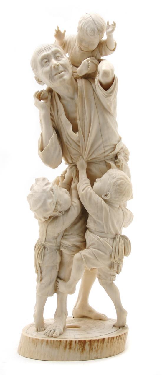 Appraisal: Figural Ivory Model of a Man with Three Boys Meiji