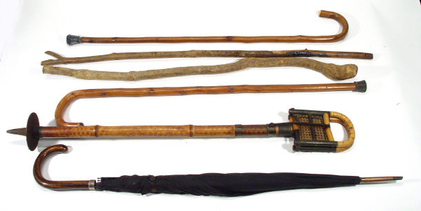 Appraisal: Cane folding shooting stick and a selection of other walking