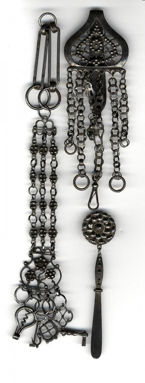 Appraisal: AN ENGLISH CUT STEEL CHATELAINE with three chains decorated with