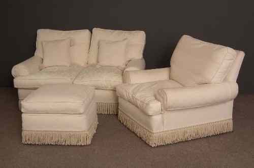 Appraisal: A modern matched lounge suite upholstered in white diaper and