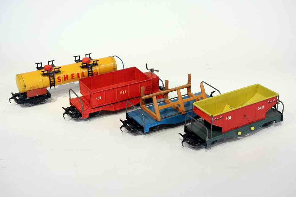 Appraisal: TIN TOY TRAIN CARS - Four s Enameled Tin Toy