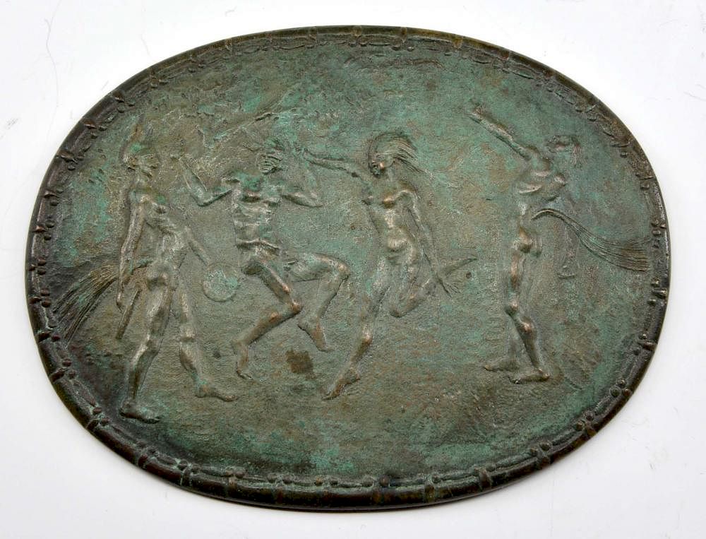 Appraisal: Patinated bronze medallion nude figures frolicking Patinated bronze medallion nude