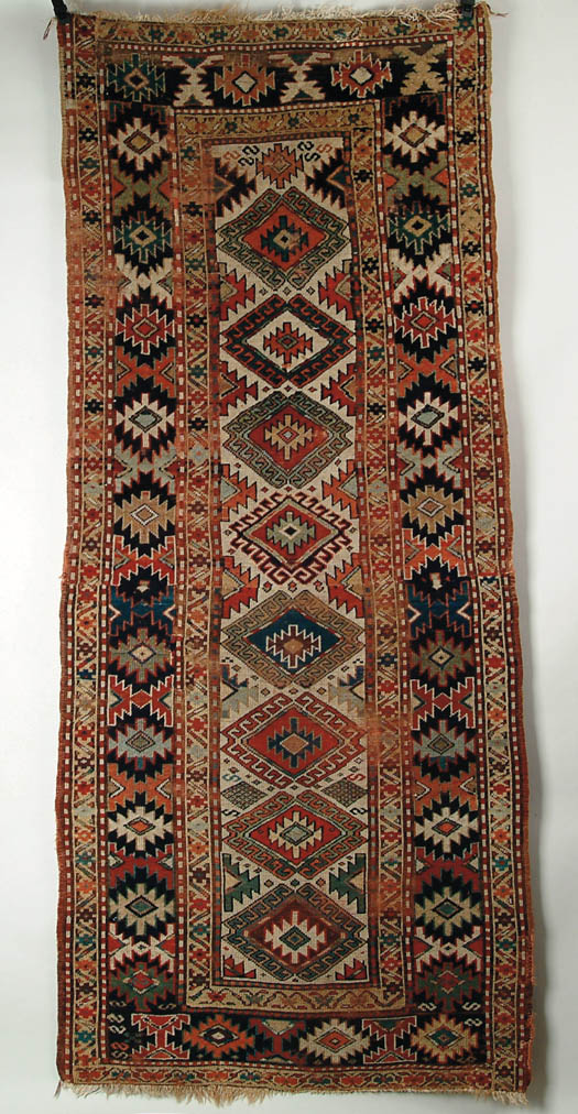 Appraisal: ANTIQUE ORIENTAL RUNNER Colorful Caucasian type rug with eight center