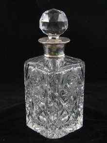 Appraisal: A silver mounted cut glass decanter London x x cm