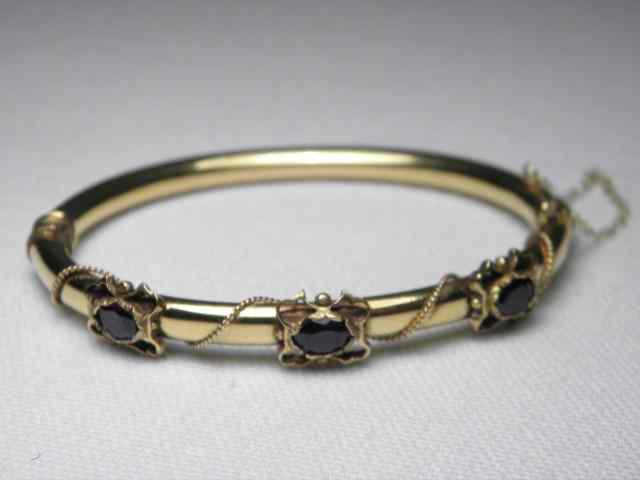 Appraisal: A kt yellow gold bangle style bracelet set with three