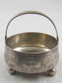 Appraisal: A Russian silver swing handled bowl on three ball feet