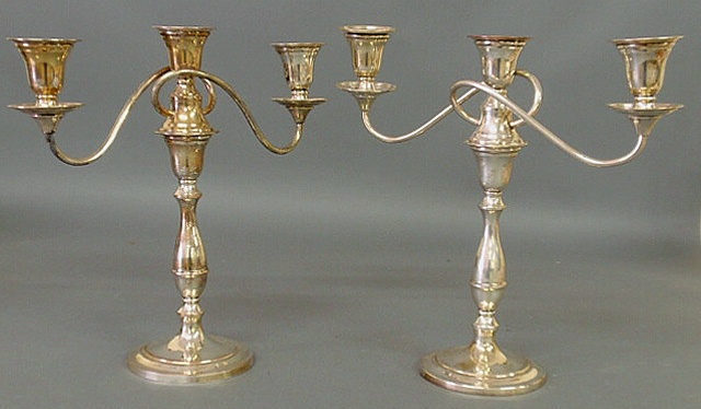 Appraisal: Pair of English weighted silverplate candelabra h x w