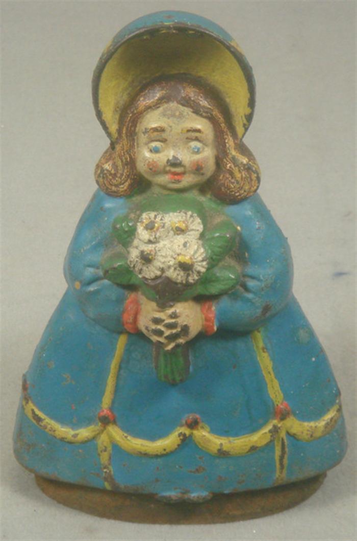 Appraisal: Cast iron doorstop girl with bonnet holding flowers in blue