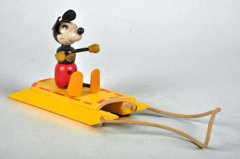 Appraisal: Wooden Disney Fun-E-Flex Mickey on Sled Description Scarce toy Appears