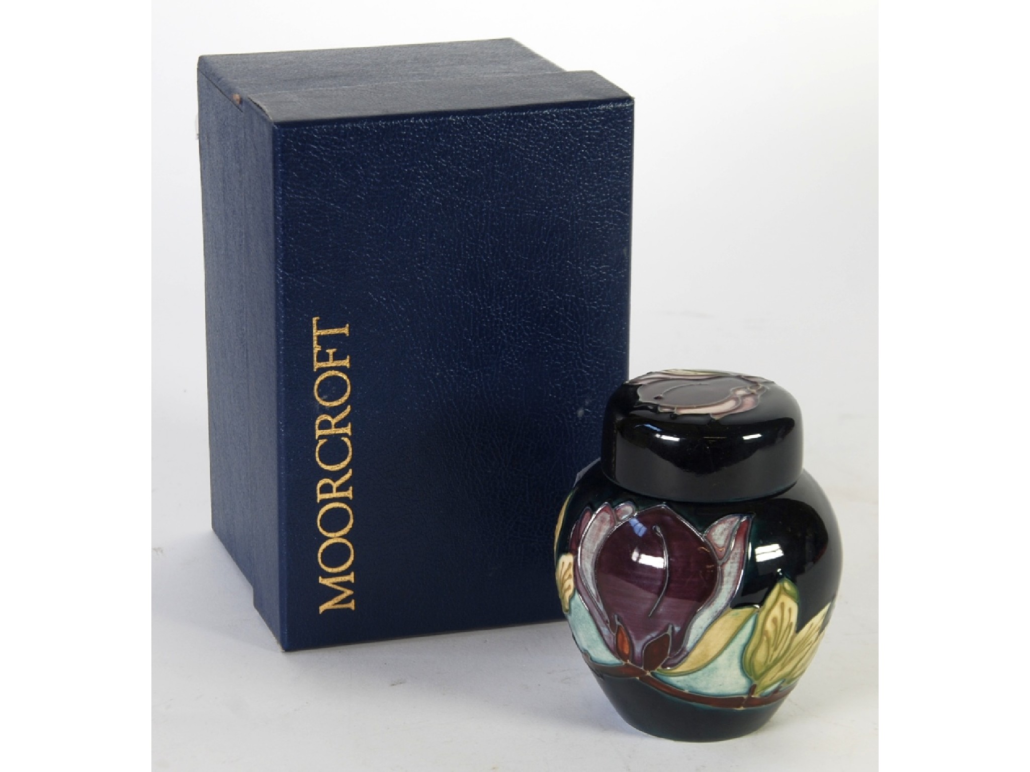 Appraisal: A MODERN MOORCROFT MAGNOLIA PATTERN WINE COLOURWAY TUBE LINED POTTERY