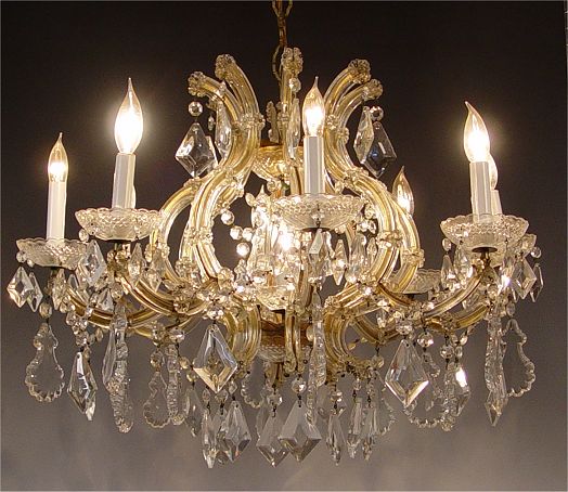 Appraisal: LIGHT CRYSTAL CHANDELIER lights on curved crystal arms Measures approx