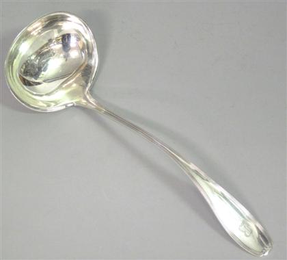 Appraisal: Sterling silver soup ladleWith an oval reeded bowl together with