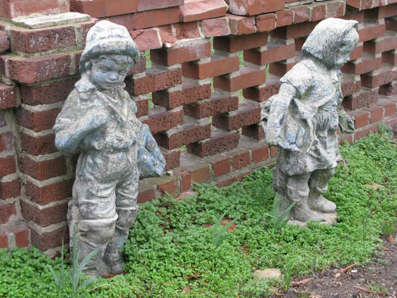 Appraisal: Pair of Vintage Cast Stone Statues young boy and girl