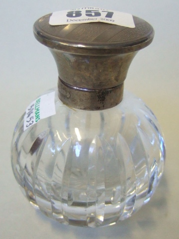 Appraisal: A silver mounted hinge lidded spherical glass scent bottle with