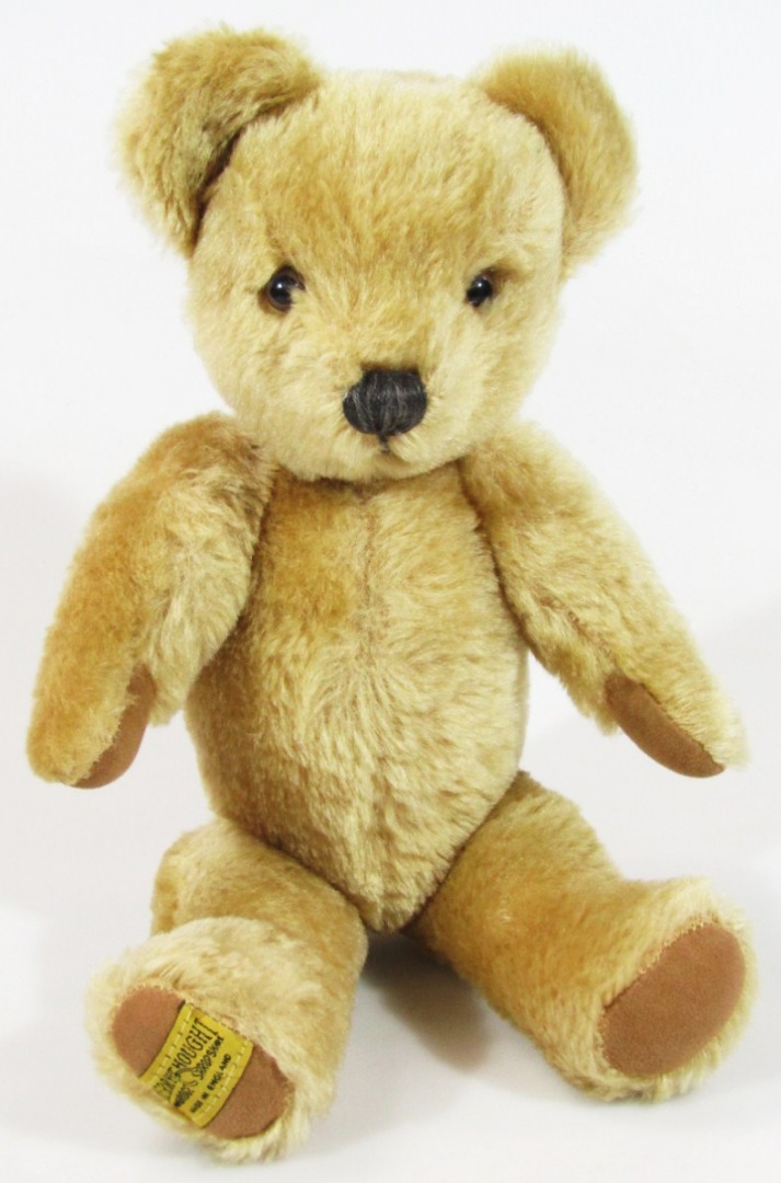 Appraisal: A thC Merrythought blonde plush jointed Teddy bear with glass