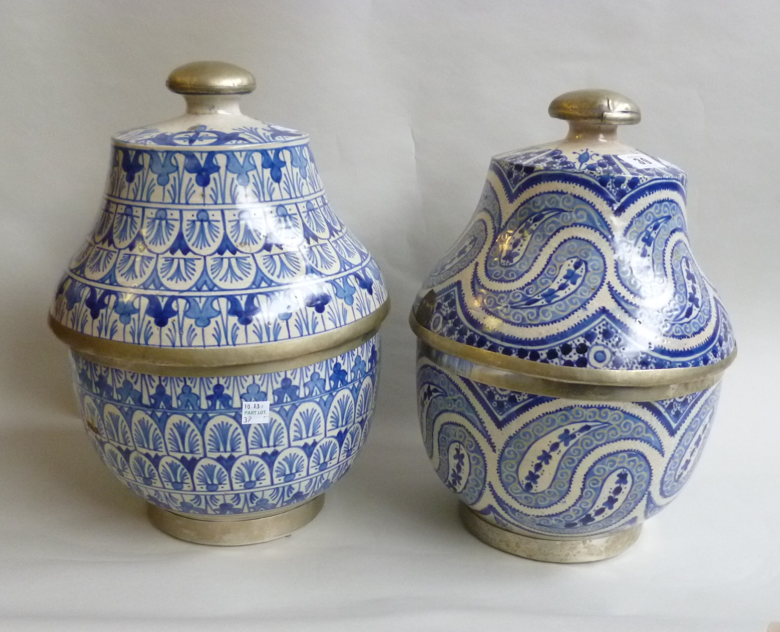 Appraisal: Two North African blue and white pottery jars and covers