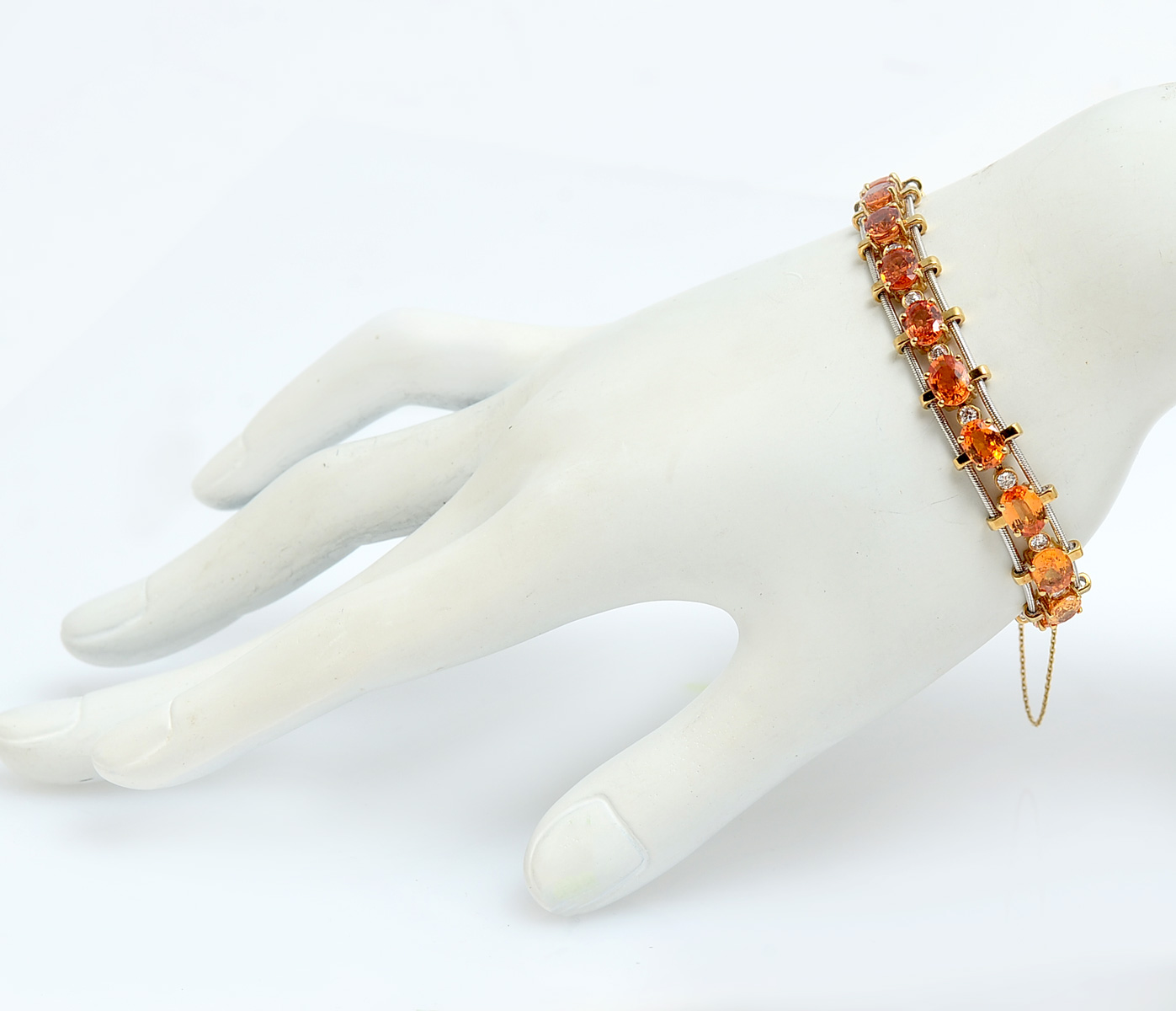 Appraisal: K ORANGE SAPPHIRE DIAMOND BRACELET oval faceted orange sapphires approx