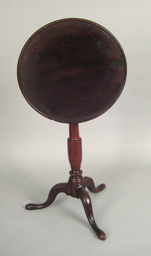 Appraisal: Pennsylvania cherry candlestand late th c the circular top tilting