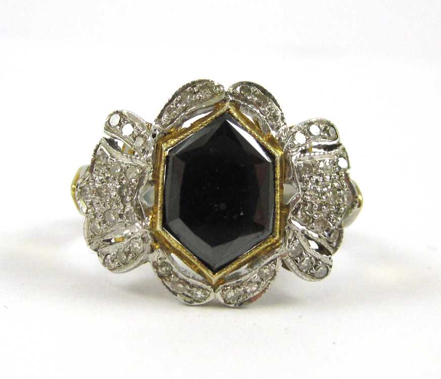 Appraisal: BLACK DIAMOND SILVER AND YELLOW GOLD RING The sterling silver