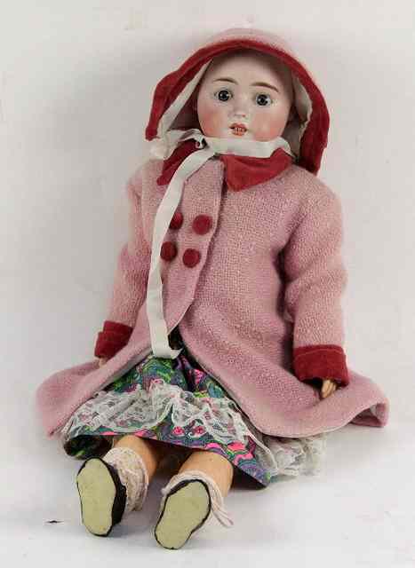 Appraisal: A Mignons German bisque headed doll with fixed blue eyes