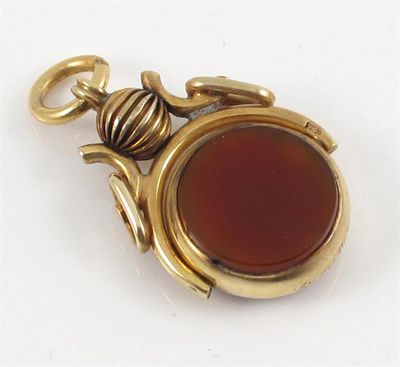 Appraisal: A gold spinning fob seal Mounted with bloodstone and carnelian