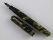 Appraisal: A lady's miniature fountain pen in marbled green by Eversharp