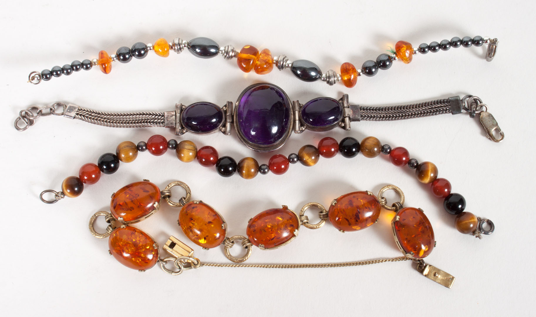 Appraisal: Four lady's colored stone bracelets of amber amethyst hematite and