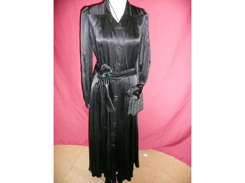 Appraisal: A 's long black button through evening dress with matching