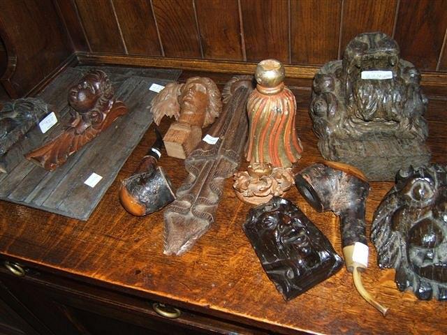 Appraisal: A collection of carved oak antique architectural elements including lion