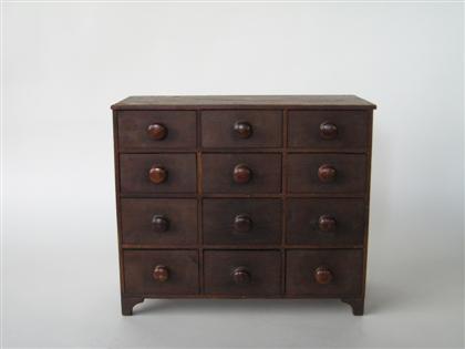 Appraisal: Twelve drawer spice chest th century Drawers with turned pulls