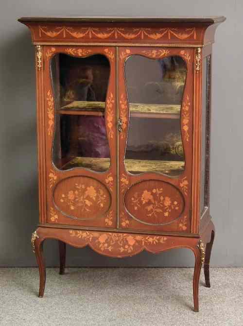 Appraisal: A th Century French walnut and marquetry dwarf display cabinet